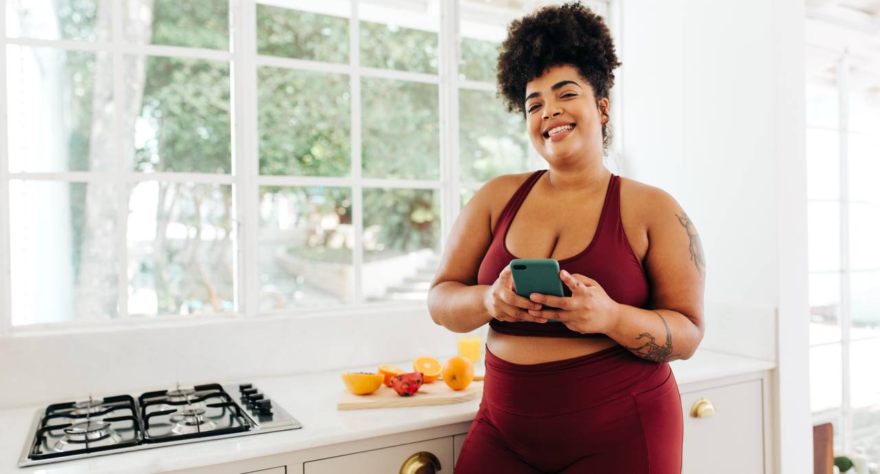 Happy woman losing weight