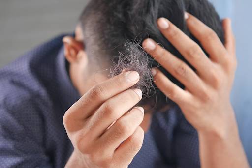 man-touching-own-hair
